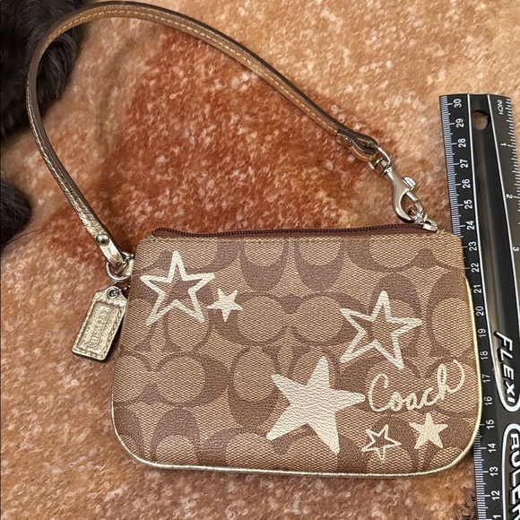 Coach Handbags - Coach Tan and Cream Star Pattern WristletNWOT